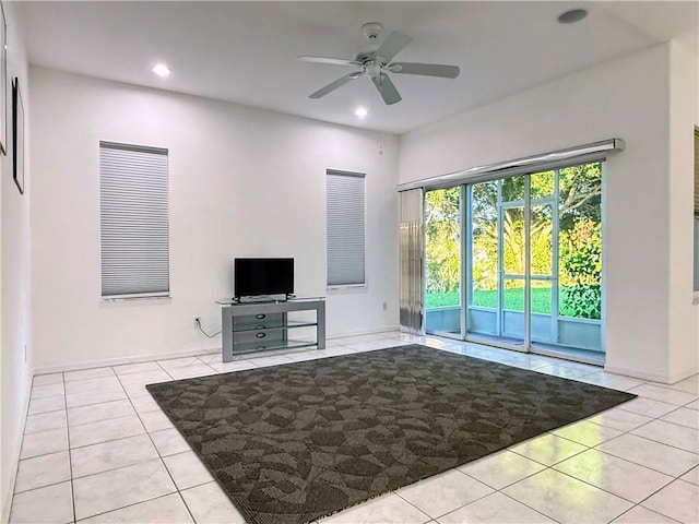 51 Joy Haven Dr, Sebastian, FL 32958 - unfurnished living room featuring light tile patterned flooring, a ceiling fan, and recessed lighting