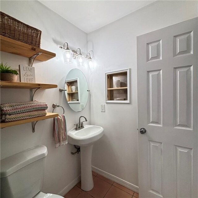 bathroom featuring tile patterned floors and toilet