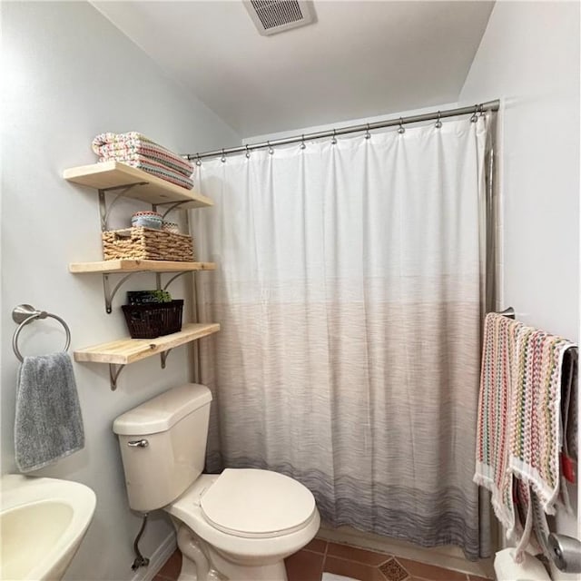 bathroom featuring tile patterned flooring, sink, a shower with curtain, and toilet