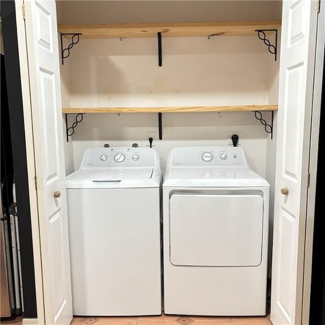 washroom featuring washer and dryer