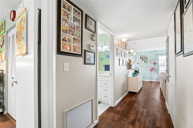 51 Woodland Dr Unit 106, Vero Beach, FL 32962 - corridor with wood finished floors and baseboards