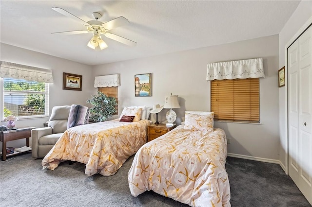 bedroom with carpet floors, a ceiling fan, baseboards, and a closet