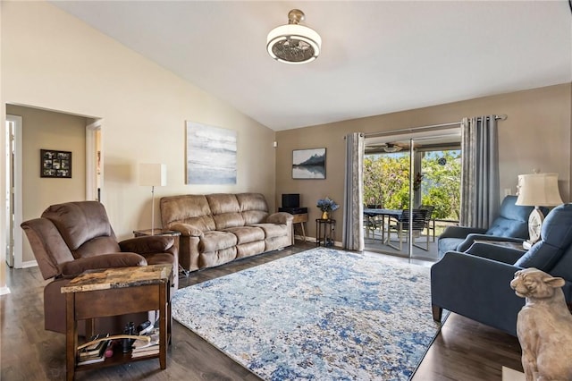 living room with lofted ceiling, baseboards, and wood finished floors