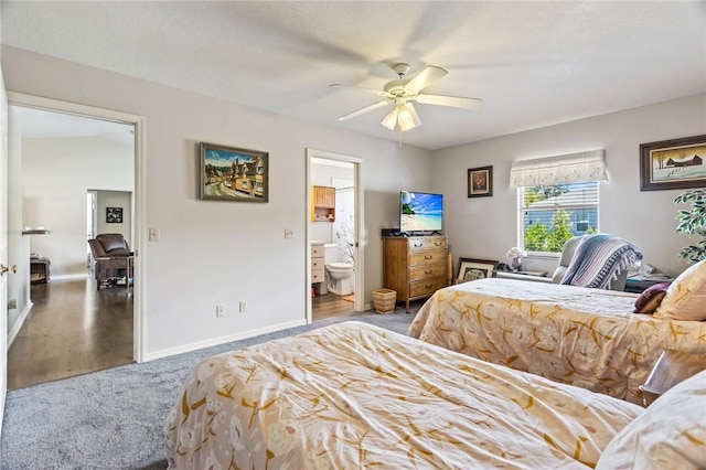 carpeted bedroom with a ceiling fan, baseboards, and ensuite bathroom