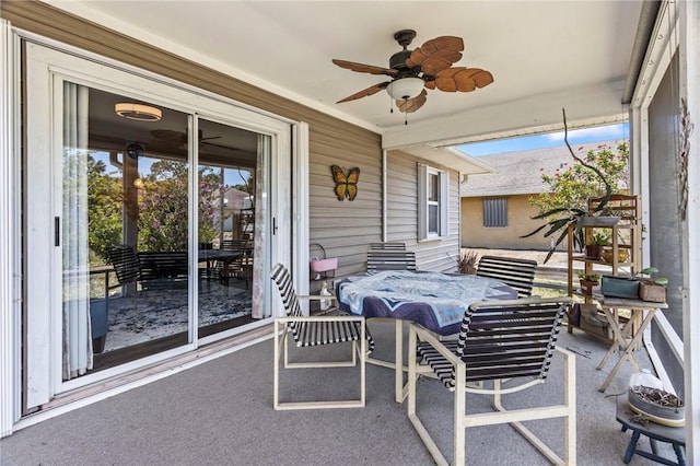 sunroom featuring ceiling fan