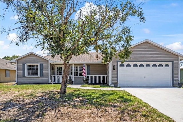 ranch-style house with a garage, driveway, a front lawn, and a porch