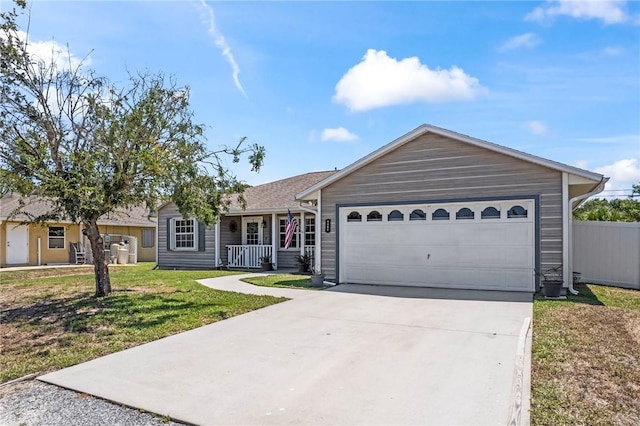 ranch-style home featuring concrete driveway, a front lawn, a porch, and an attached garage