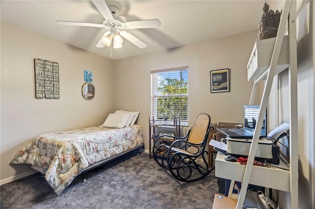 carpeted bedroom featuring ceiling fan and baseboards