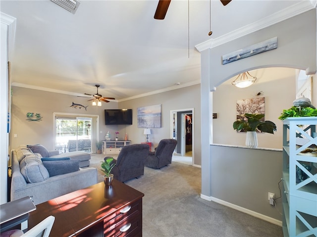 carpeted living room with crown molding and ceiling fan