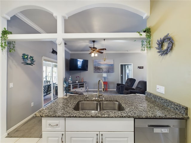 kitchen with sink, crown molding, dishwasher, dark stone counters, and white cabinets