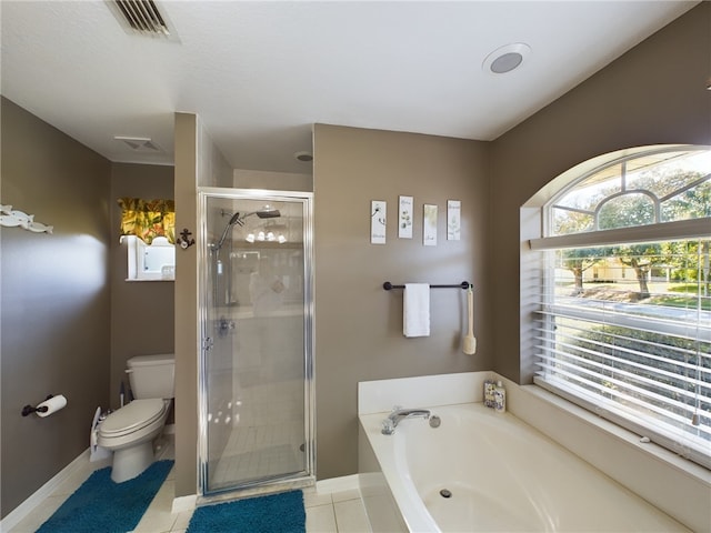 bathroom with tile patterned floors, independent shower and bath, and toilet