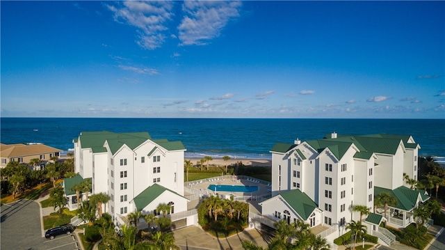 aerial view with a beach view and a water view