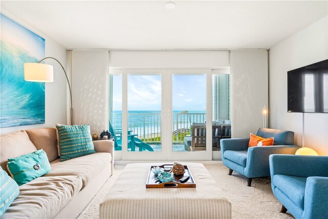 carpeted living room with french doors