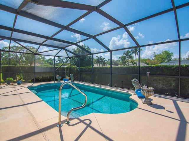 view of swimming pool with a fenced in pool, a lanai, and a patio area