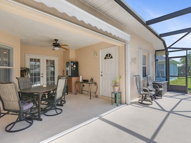 sunroom / solarium with french doors and ceiling fan