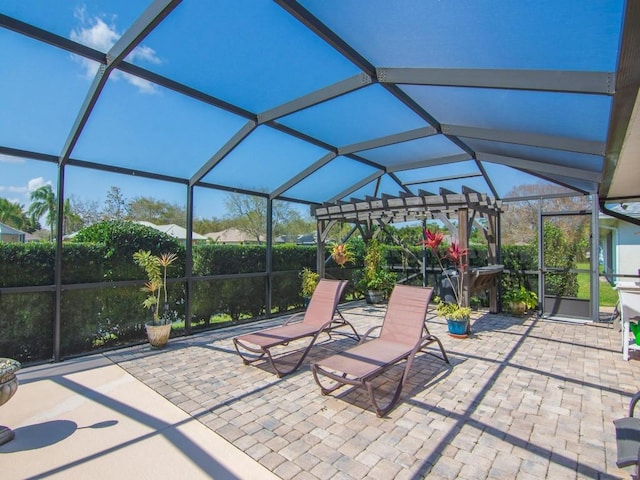 view of patio / terrace featuring glass enclosure