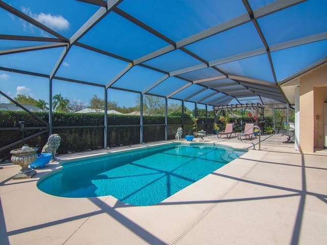 view of swimming pool featuring a fenced in pool, a lanai, and a patio area