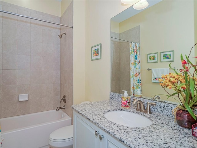 full bathroom featuring vanity, shower / tub combo, and toilet