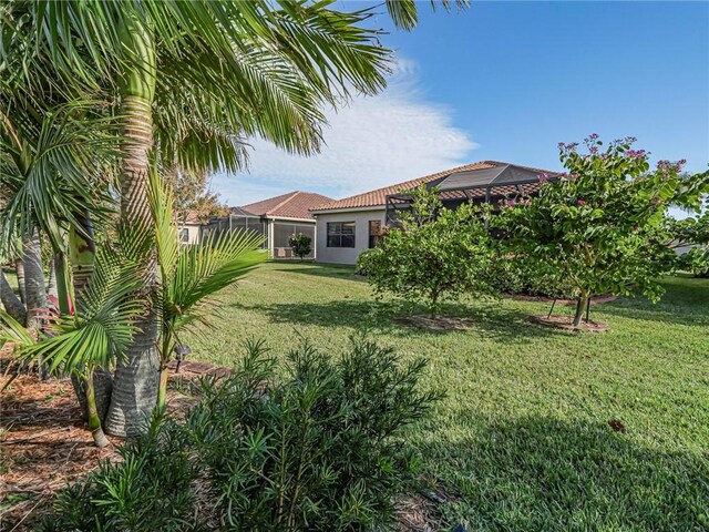 view of yard with a lanai