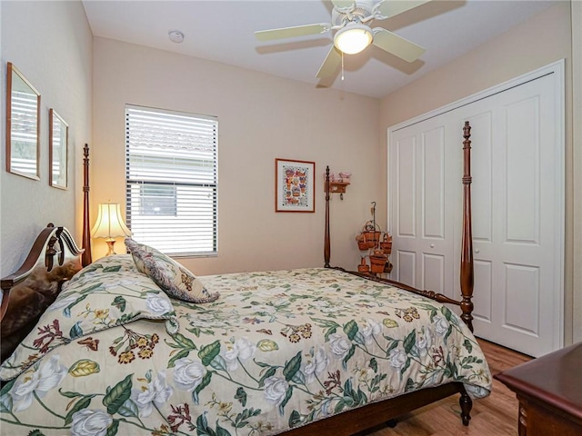 bedroom featuring hardwood / wood-style flooring, a closet, and ceiling fan