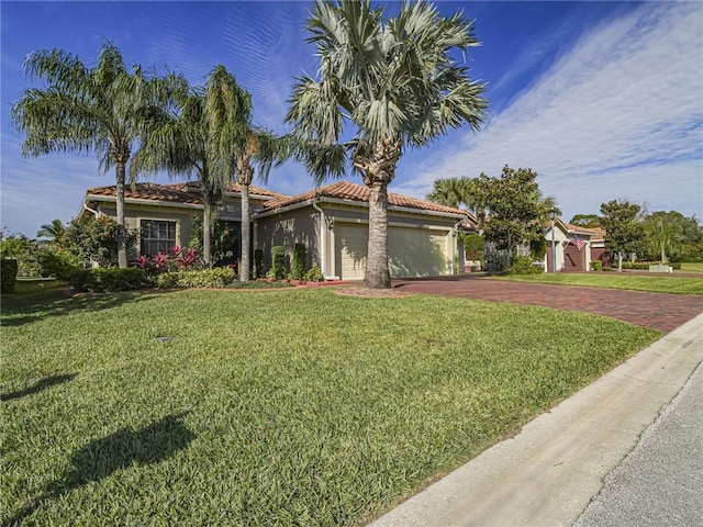 view of front of house with a front yard and a garage