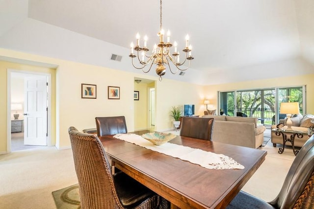 dining room with a notable chandelier, light carpet, visible vents, baseboards, and a tray ceiling