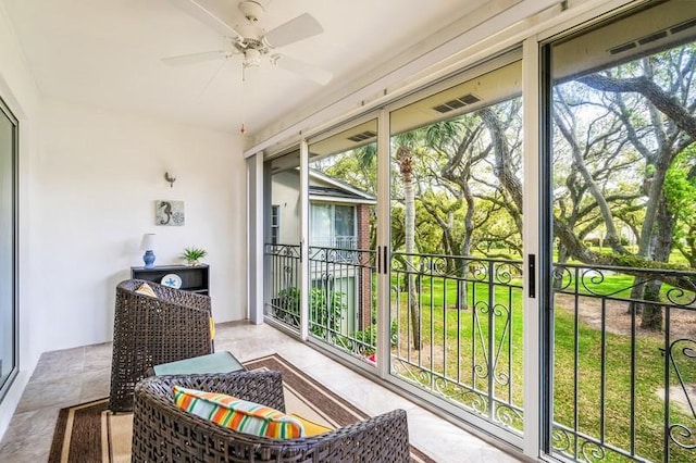 sunroom with a ceiling fan