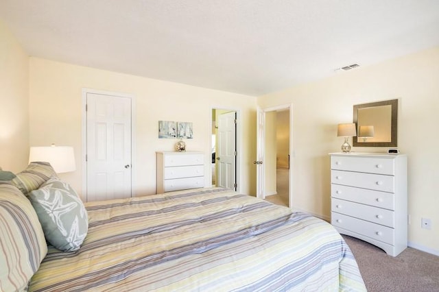 carpeted bedroom with visible vents