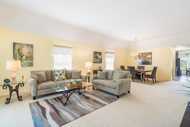 living room with carpet floors, a healthy amount of sunlight, and baseboards