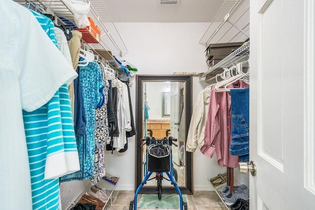 spacious closet with tile patterned flooring and visible vents