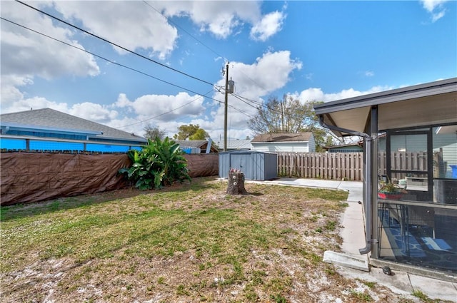 view of yard with a storage unit