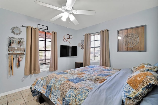 bedroom with light tile patterned floors and ceiling fan