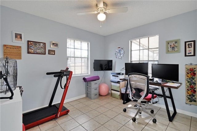 office area featuring ceiling fan, a healthy amount of sunlight, and light tile patterned flooring