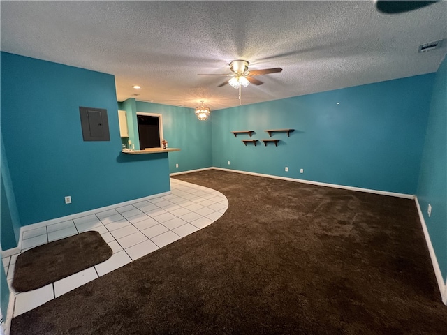 carpeted empty room with a textured ceiling and ceiling fan