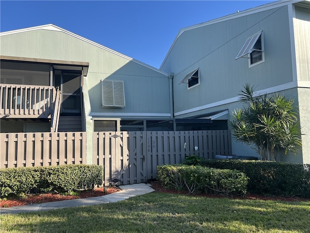 view of side of home featuring a yard