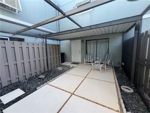 view of patio / terrace with a lanai