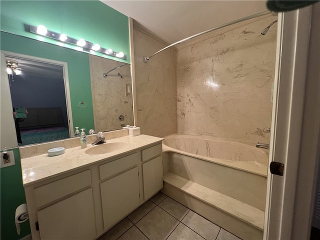 bathroom featuring washtub / shower combination, tile patterned floors, and vanity