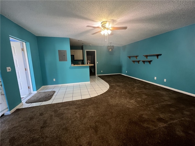 unfurnished living room with electric panel, light colored carpet, a textured ceiling, and ceiling fan