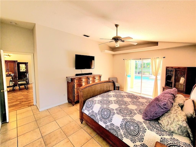 bedroom featuring ceiling fan, light tile patterned floors, and access to outside