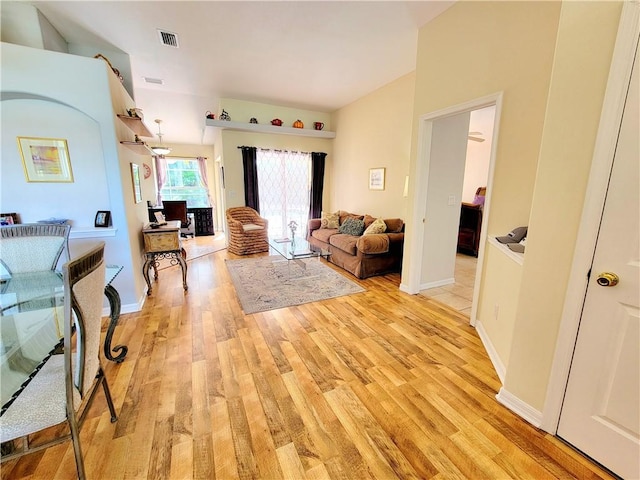 living room with light hardwood / wood-style flooring