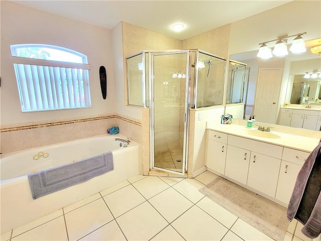 bathroom featuring vanity, separate shower and tub, and tile patterned flooring