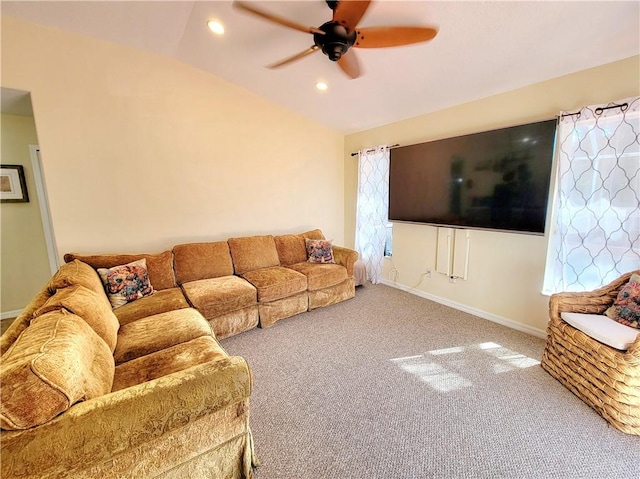 living room featuring lofted ceiling, ceiling fan, and carpet