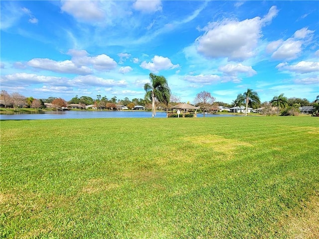 view of yard with a gazebo and a water view