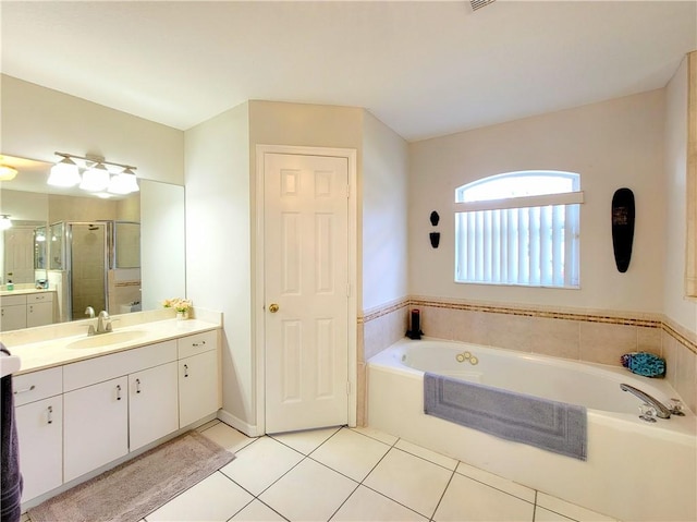 bathroom with shower with separate bathtub, tile patterned floors, and vanity