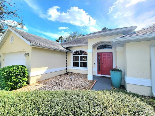 property entrance with a garage