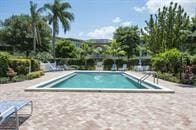 community pool with a patio area