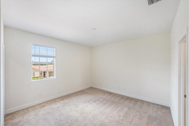 263 Provence Pl, Vero Beach, FL 32960 - unfurnished room featuring light carpet and baseboards