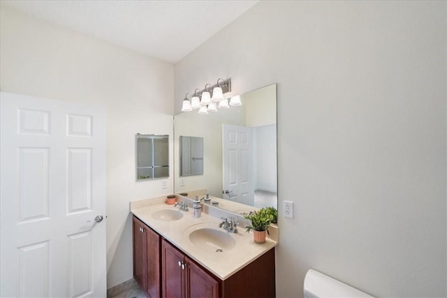 263 Provence Pl, Vero Beach, FL 32960 - bathroom featuring toilet and double vanity