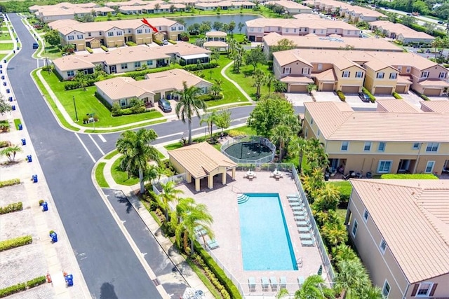 263 Provence Pl, Vero Beach, FL 32960 - aerial perspective of suburban area with a pool and a nearby body of water