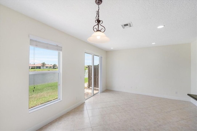 263 Provence Pl, Vero Beach, FL 32960 - spare room featuring recessed lighting, a textured ceiling, and light tile patterned floors